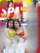 A magazine with two women in a swimming pool.