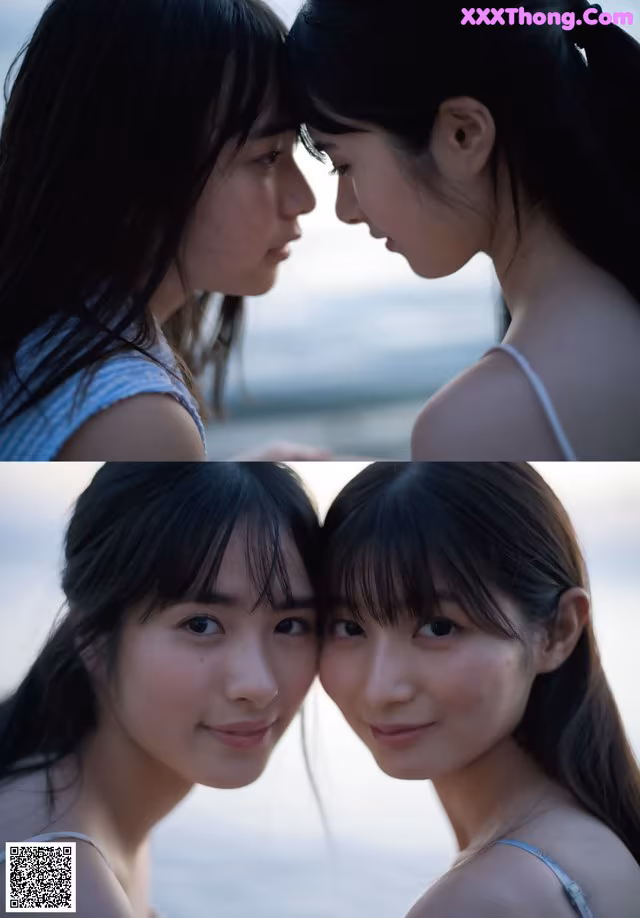 A couple of young women standing next to each other on a beach.